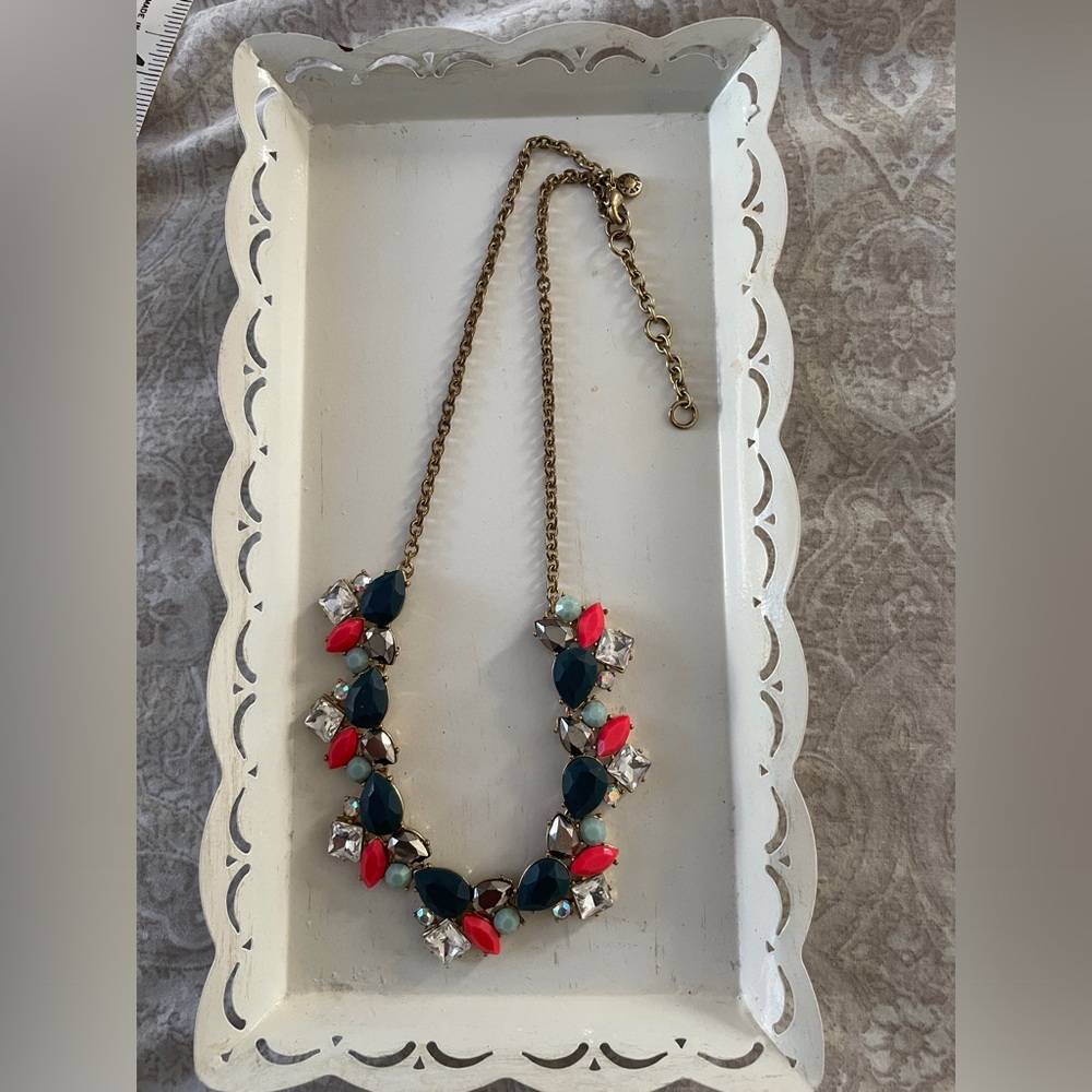 Jcrew necklace with stones in shades of blue, orange, clear and gray. 18”